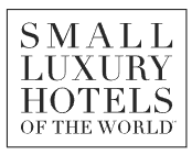 Luxuriöse Unterkünfte bei Small Luxury Hotels of the World Logo von Small Luxury Hotels of the World, das exklusive und kleine Luxushotels weltweit repräsentiert.